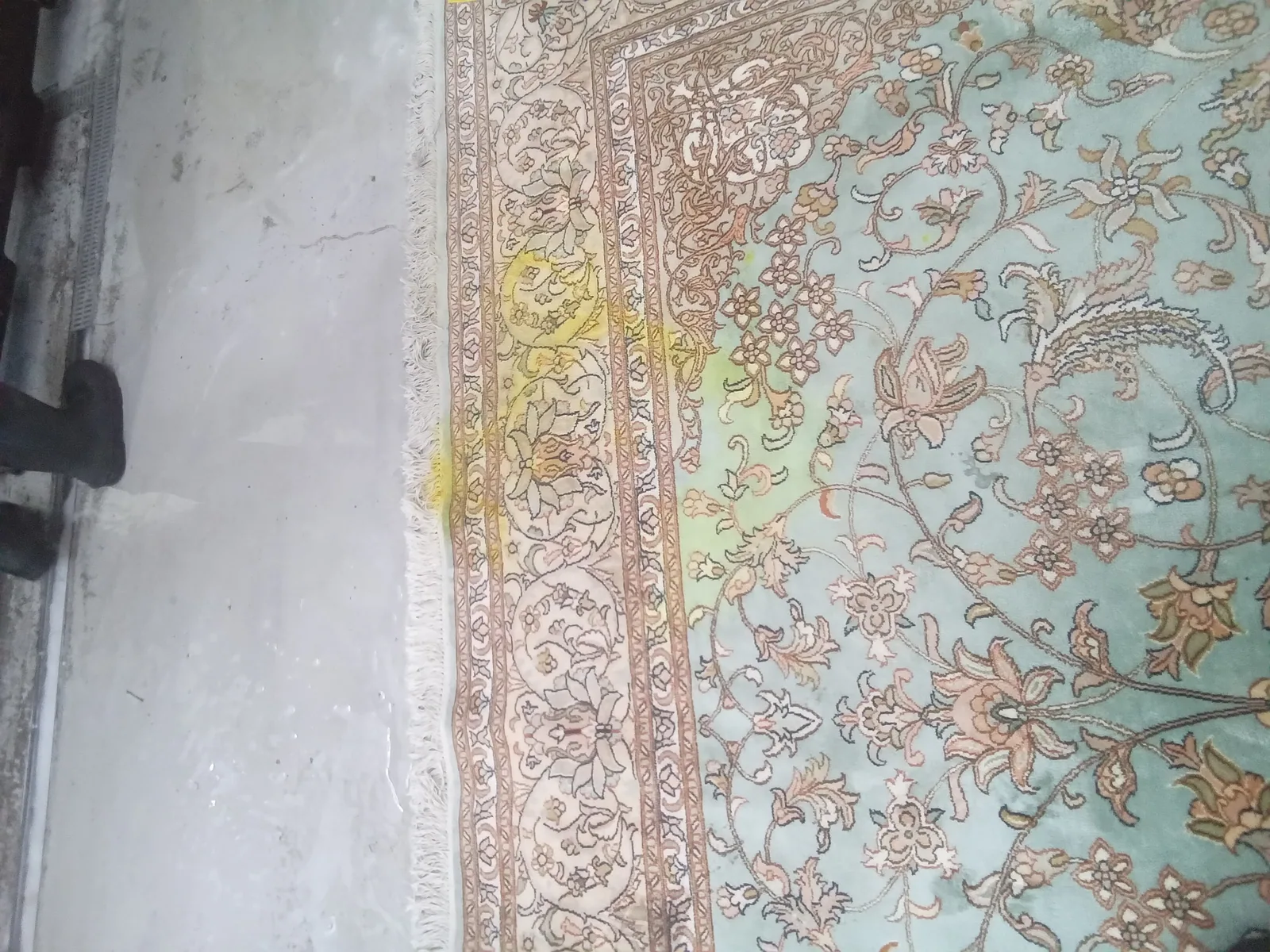 From a job in Boynton Beach: a pale, finely woven rug spread out at the plant